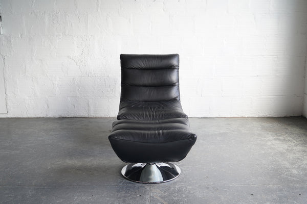 Black leather swivel online armchair