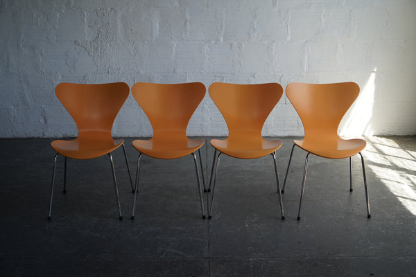 Arne Jacobsen Series 7 Chairs in Orange The Good Mod